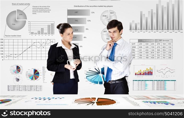Business analytics. Businessman and businesswoman analyzing data information of market