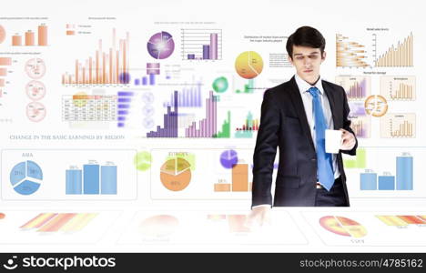 Business analytics. Young businessman analyzing data information of market