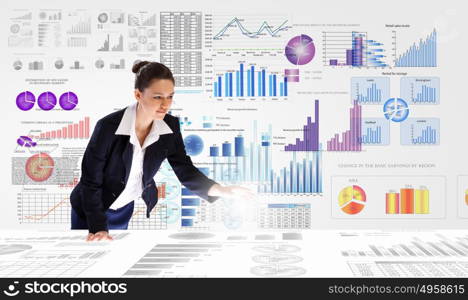 Business analytics. Young businesswoman analyzing data information of market