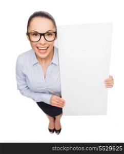 business and advertisement concept - smiling businesswoman in eyeglasses with white blank board