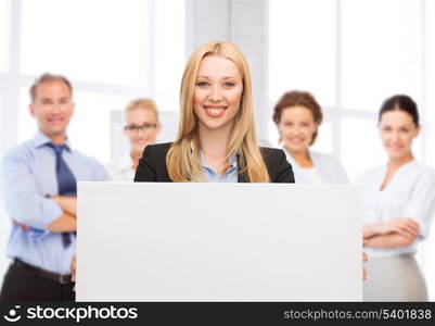 business and advertising concept - smiling businesswoman with white blank board