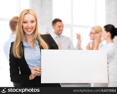 business and advertising concept - smiling businesswoman with white blank board