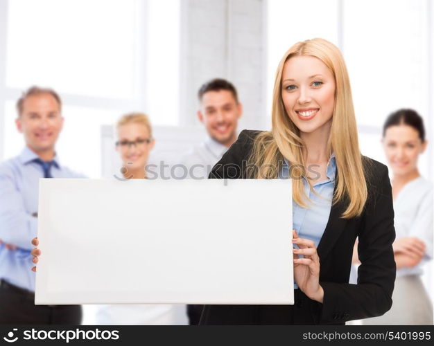 business and advertising concept - smiling businesswoman with white blank board