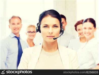 business and call center concept - helpline operator with headphones in call centre. helpline operator with headphones in call centre