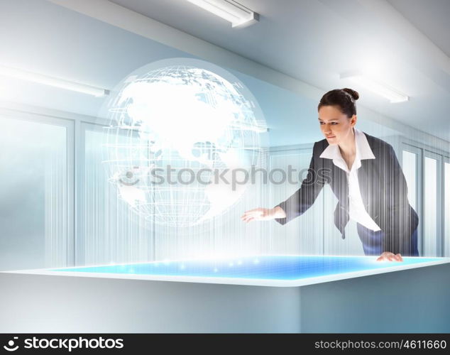 Business and communication innovations. Image of young businesswoman clicking icon on high-tech picture