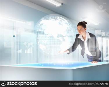Business and communication innovations. Image of young businesswoman clicking icon on high-tech picture