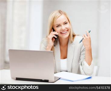 business and communication - smiling businesswoman with smartphone in office