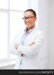 business and education concept - african businesswoman in office