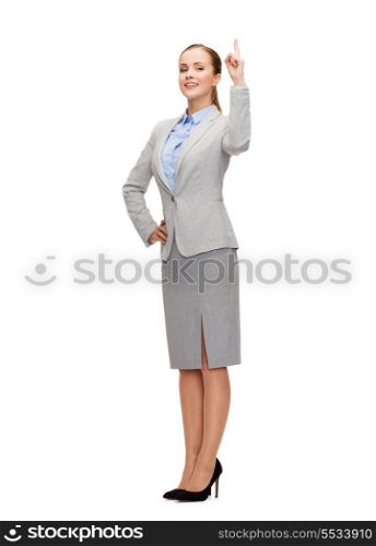 business and education concept - attractive young businesswoman with her finger up