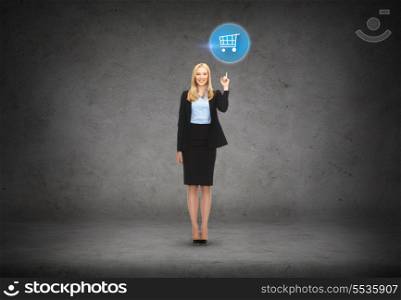 business and education concept - attractive young businesswoman with her finger up and shopping trolley