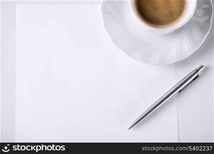 business and education concept - blank paper for note and coffee