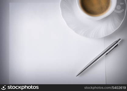 business and education concept - blank paper for note and coffee