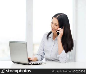 business and education concept - businesswoman with laptop and cell phone