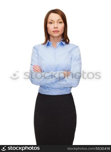 business and education concept - friendly young businesswoman with crossed arms