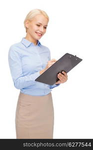 business and education concept - friendly young smiling businesswoman with clipboard and pen