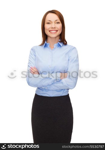 business and education concept - friendly young smiling businesswoman with crossed arms