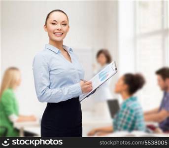 business and education concept - friendly young smiling teacher with clipboard and pen