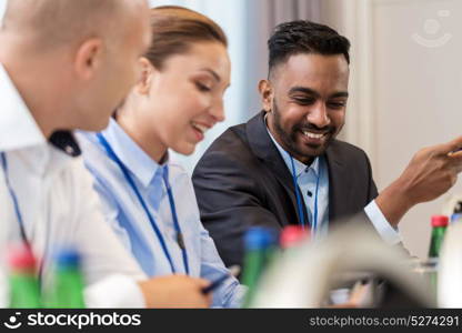 business and education concept - group of people at international conference. happy business team at international conference