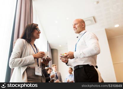 business and education concept - group of people at international conference coffee break. happy business team at international conference