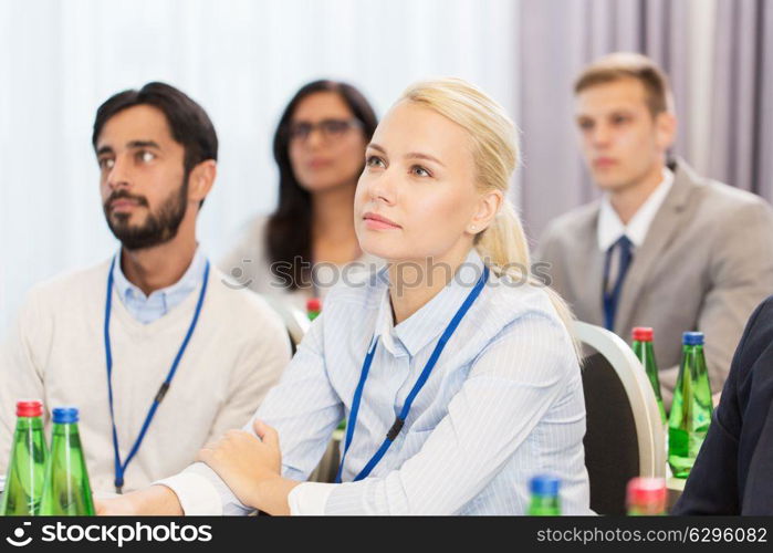 business and education concept - group of people at international conference or lecture. happy business team at international conference