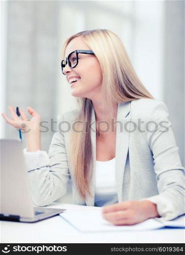 business and education concept - indoor picture of smiling woman with documents and pen. businesswoman with documents