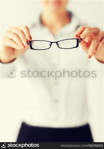 business and education concept - indoor picture of woman with eyeglasses