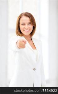business and education concept - smiling businesswoman pointing finger at you