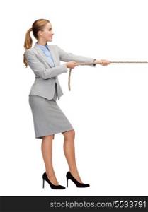 business and education concept - smiling businesswoman pulling rope