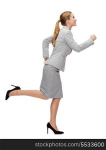 business and education concept - smiling businesswoman running