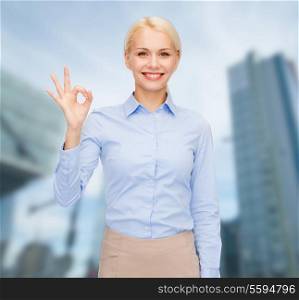 business and education concept - smiling businesswoman showing ok-sign with hand