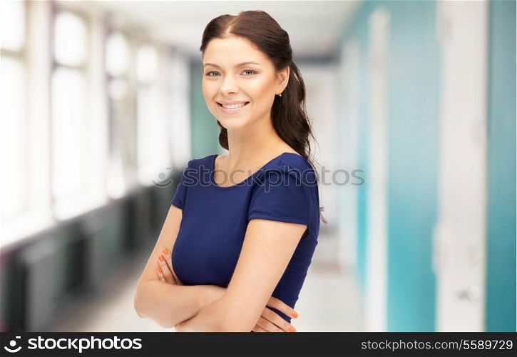 business and education concept - smiling businesswoman, teacher or student at school or office