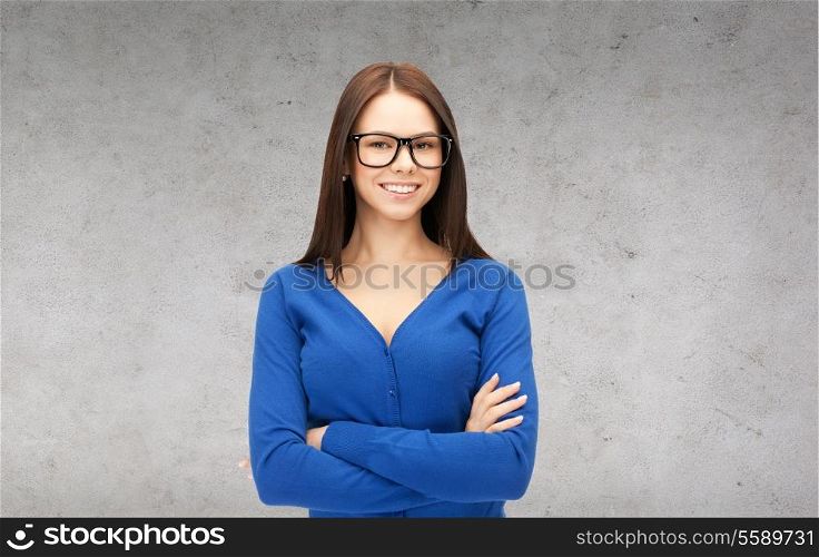 business and education concept - smiling businesswoman, teacher or student in glasses