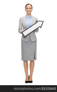 business and education concept - smiling businesswoman with direction arrow sign