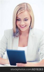 business and education concept - smiling student girl with tablet pc or e-book reader. smiling student girl with tablet pc