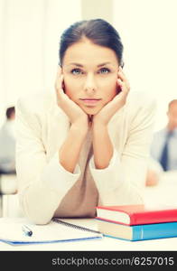 business and education concept - stressed businesswoman in office. stressed businesswoman in office