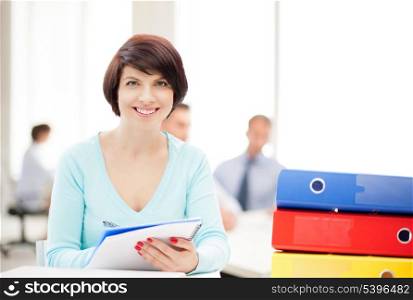 business and education concept - woman with folders