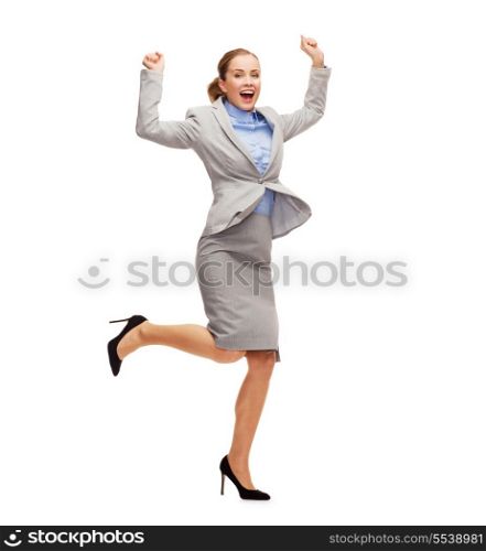 business and education concept - young happy woman jumping with hands up