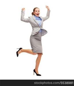 business and education concept - young happy woman jumping with hands up