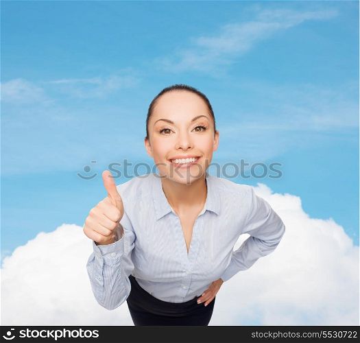 business and emotion concept - friendly smiling asian businesswoman showing thumbs up