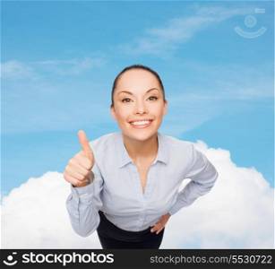 business and emotion concept - friendly smiling asian businesswoman showing thumbs up