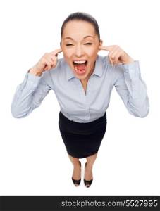 business and emotion concept - frightened businesswoman screaming with closed ears