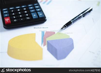 Business and finance concept. Closeup of pen and calculator on paper chart.