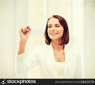 business and future technology concept - businesswoman writing in the air in the air