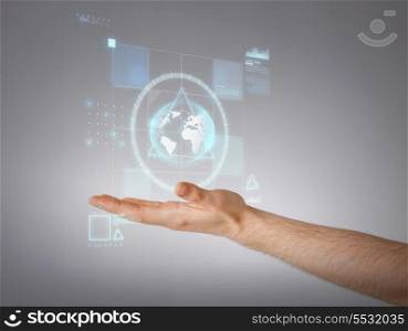 business and future technology concept - close up of male hand showing something