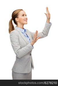 business and future technology concept - smiling businesswoman pointing to something or pressing imaginary button