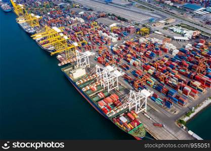 business and industry group logistics shipping cargo containers import and export international ocean fright at terminal rayong Thailand aerial view from drone