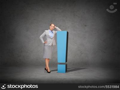 business and information concept - smiling businesswoman with exclamation mark