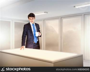 Business and innovation technologies. young businessman standing in background of high-tech image