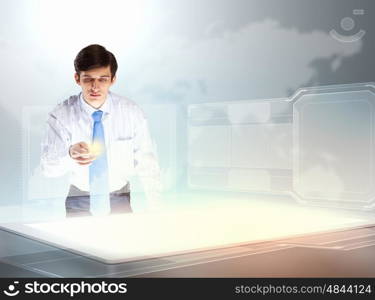 Business and innovation technologies. young businessman touching icon of high-tech image