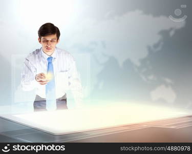 Business and innovation technologies. young businessman touching icon of high-tech image